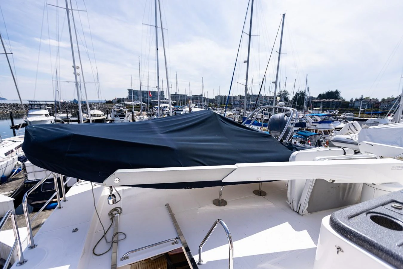 A covered area on the yacht's deck, surrounded by other boats in a marina. aboard DAWN TRADER VII Yacht for Sale