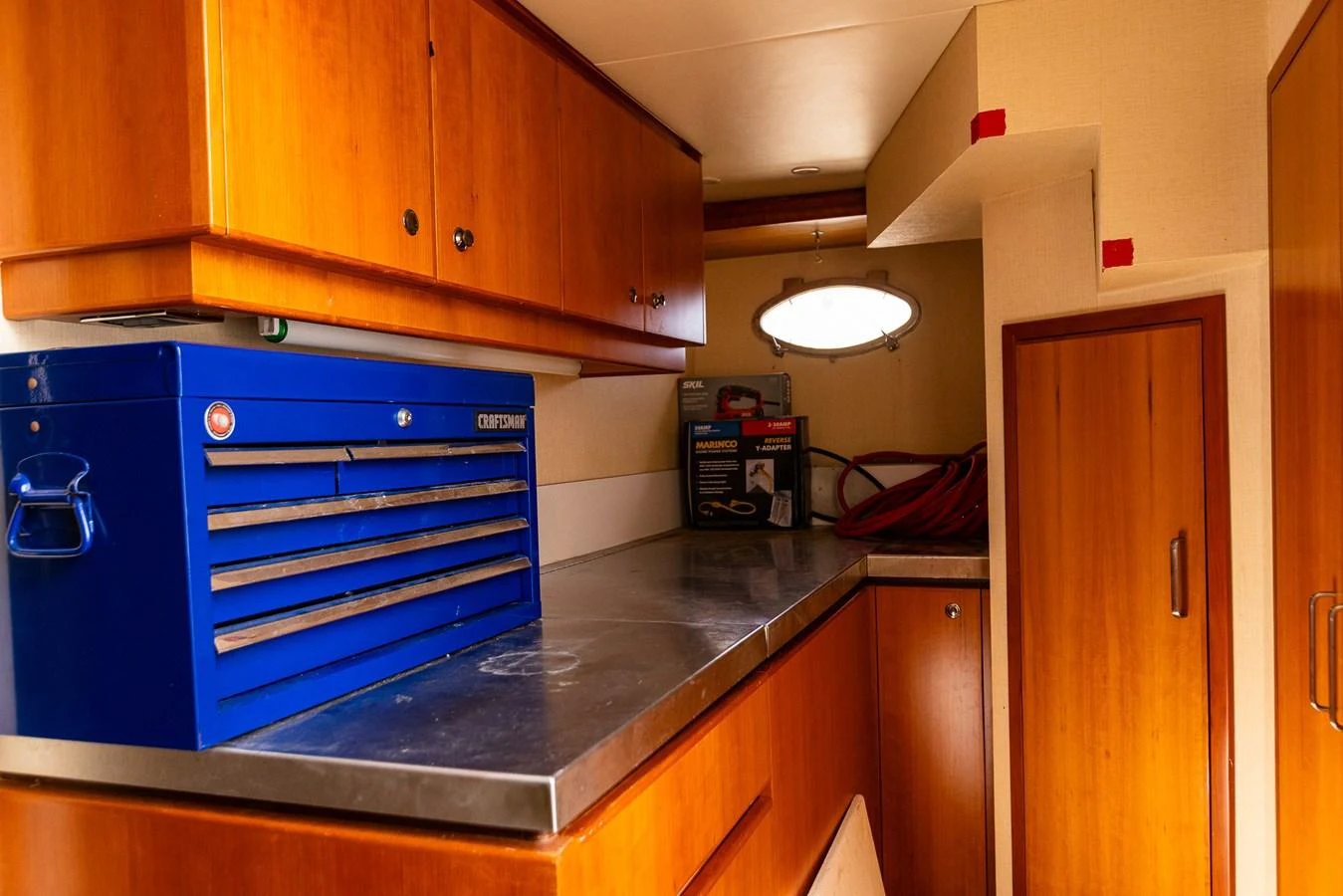 The yacht features a well-equipped workshop with ample storage and a sturdy workbench. aboard DAWN TRADER VII Yacht for Sale