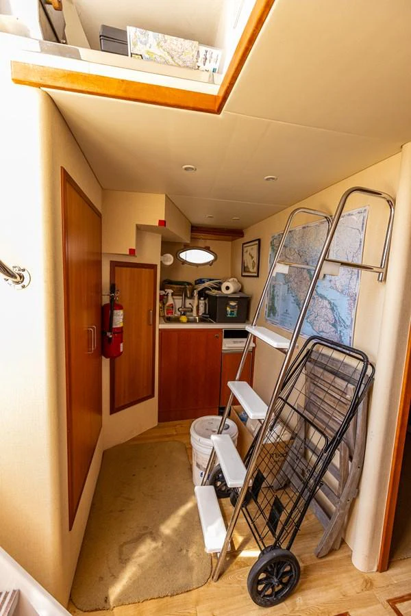 A cozy interior space featuring practical storage and essential equipment. aboard DAWN TRADER VII Yacht for Sale