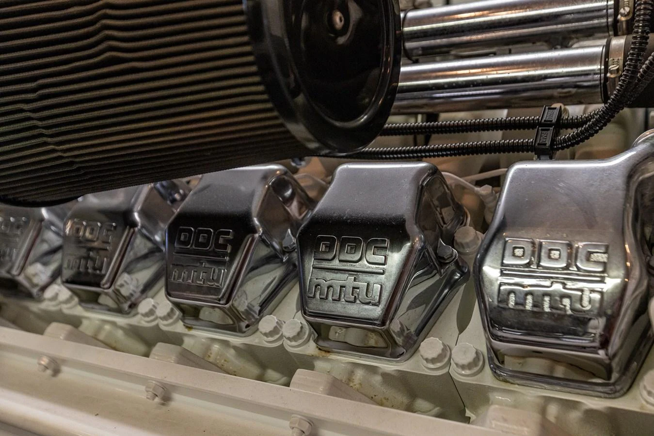 A close-up view of the yacht's powerful engine components, showcasing polished metal and intricate engineering. aboard DAWN TRADER VII Yacht for Sale