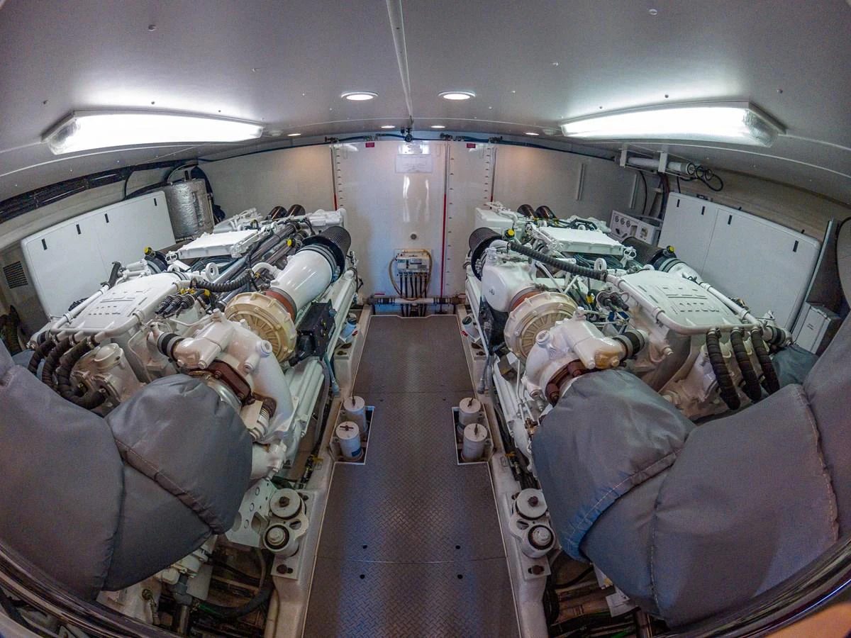 The image showcases the yacht's well-maintained engine room with twin engines. aboard DAWN TRADER VII Yacht for Sale