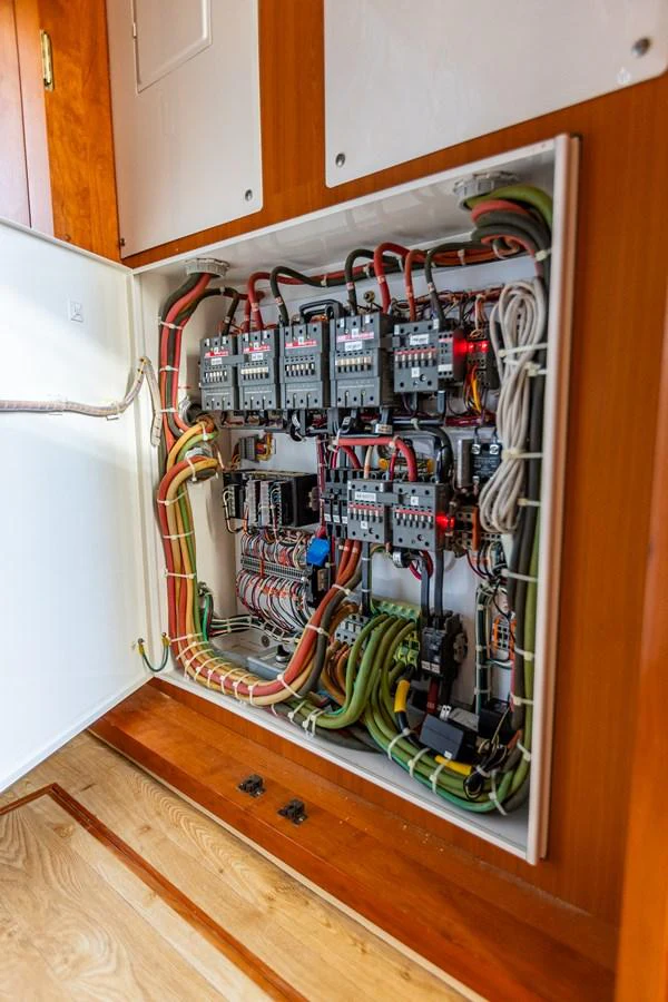 A detailed view of the yacht's electrical panel showcasing its intricate wiring and components. aboard DAWN TRADER VII Yacht for Sale