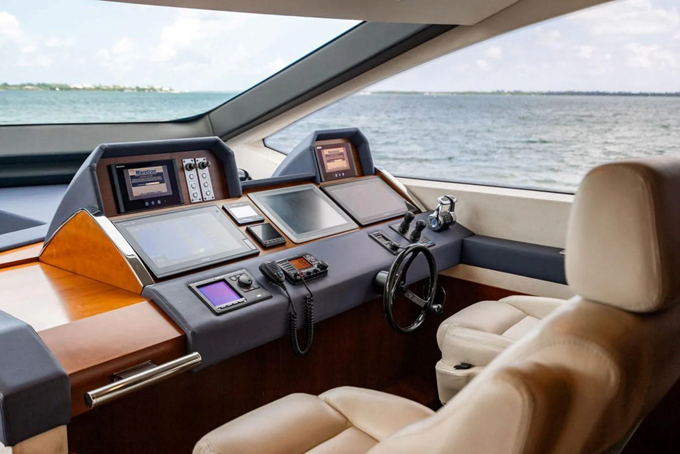 The helm station offers a commanding view with state-of-the-art navigation equipment and luxurious seating. aboard BEAUTIFUL M Yacht for Sale