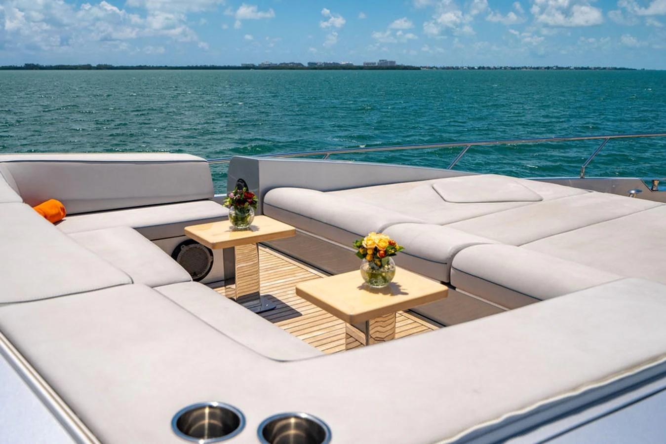 The sundeck offers a luxurious lounging area with comfortable seating and scenic ocean views. aboard BEAUTIFUL M Yacht for Sale
