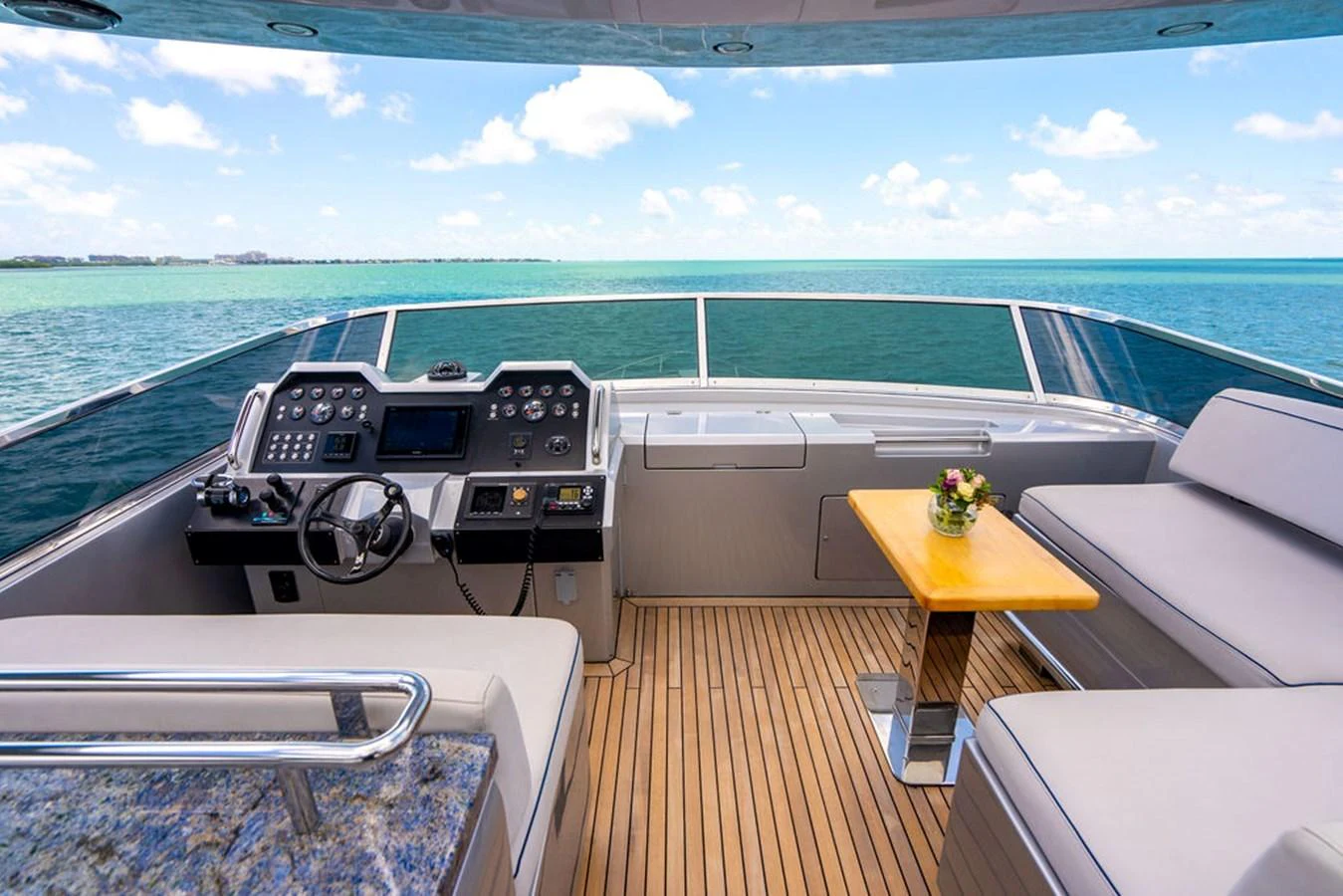 The helm area offers a luxurious and comfortable space with stunning ocean views. aboard BEAUTIFUL M Yacht for Sale