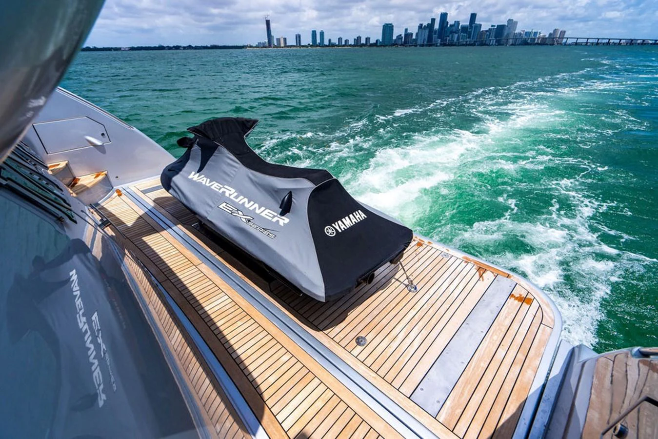The aft deck features a sleek Yamaha WaveRunner, perfect for thrilling water adventures. aboard BEAUTIFUL M Yacht for Sale