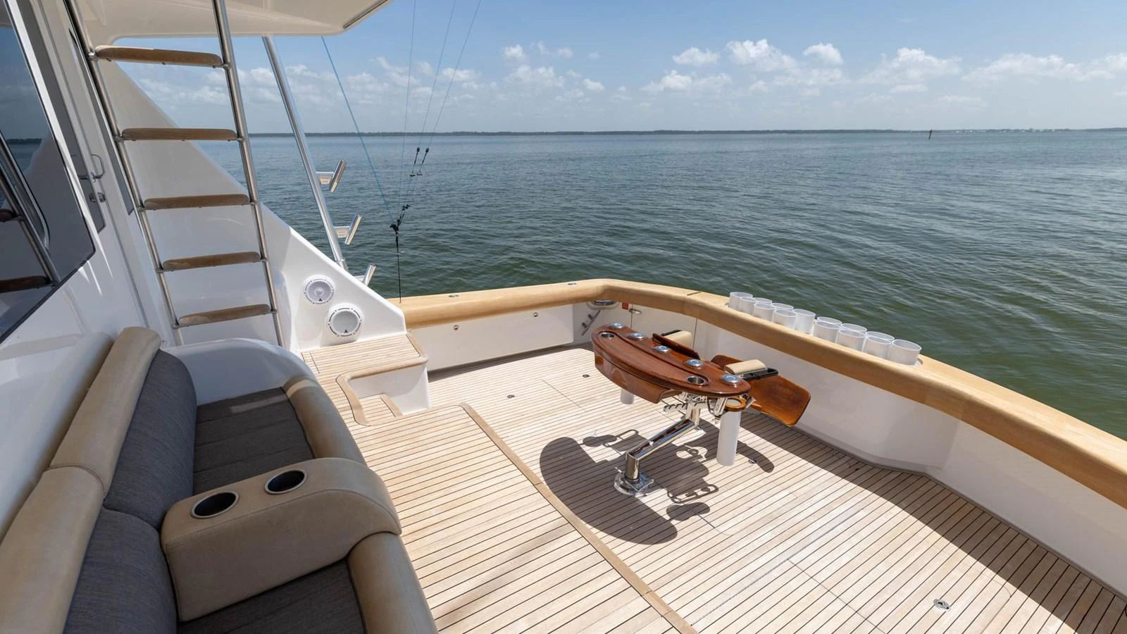 The aft deck offers a spacious and inviting area for relaxation and fishing with a stunning view of the open water. aboard CE Yacht for Sale