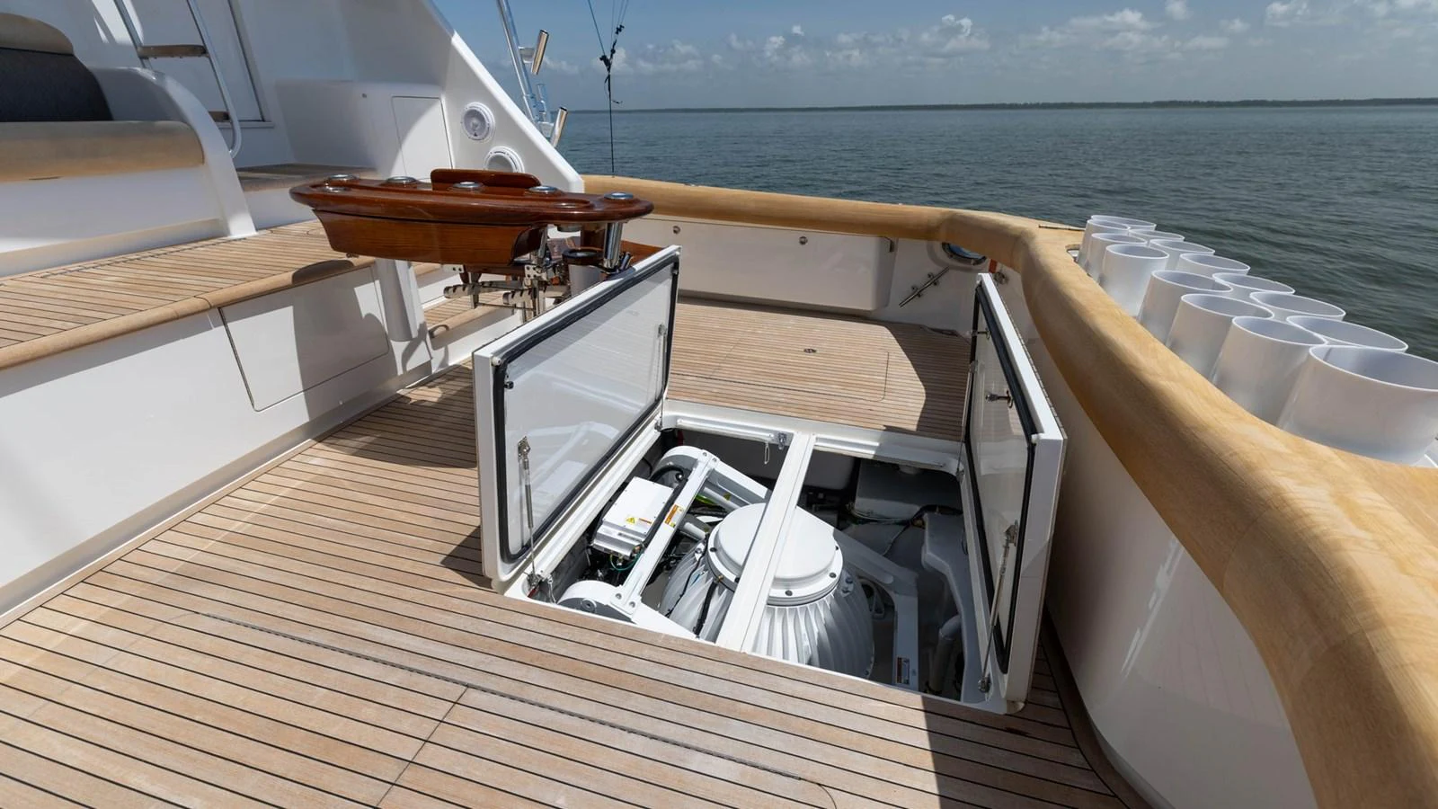 This image showcases the technical compartment of the yacht, highlighting its well-maintained machinery and storage area on the deck. aboard CE Yacht for Sale
