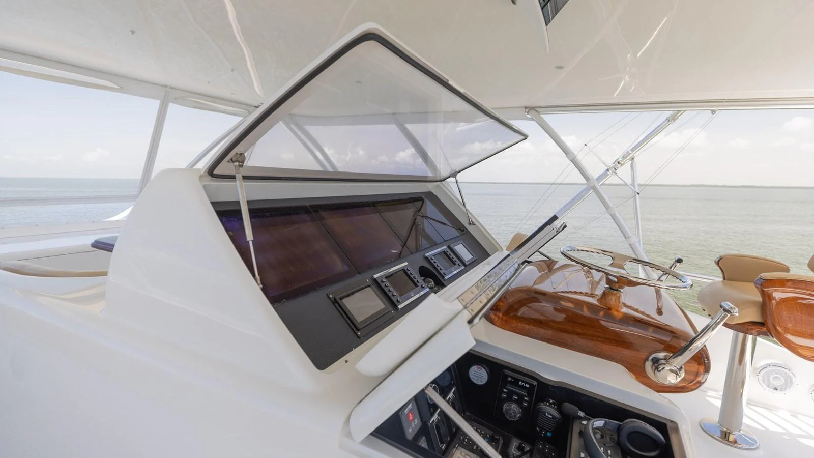 The helm station offers a sophisticated control area with state-of-the-art navigation equipment and a sleek design. aboard CE Yacht for Sale