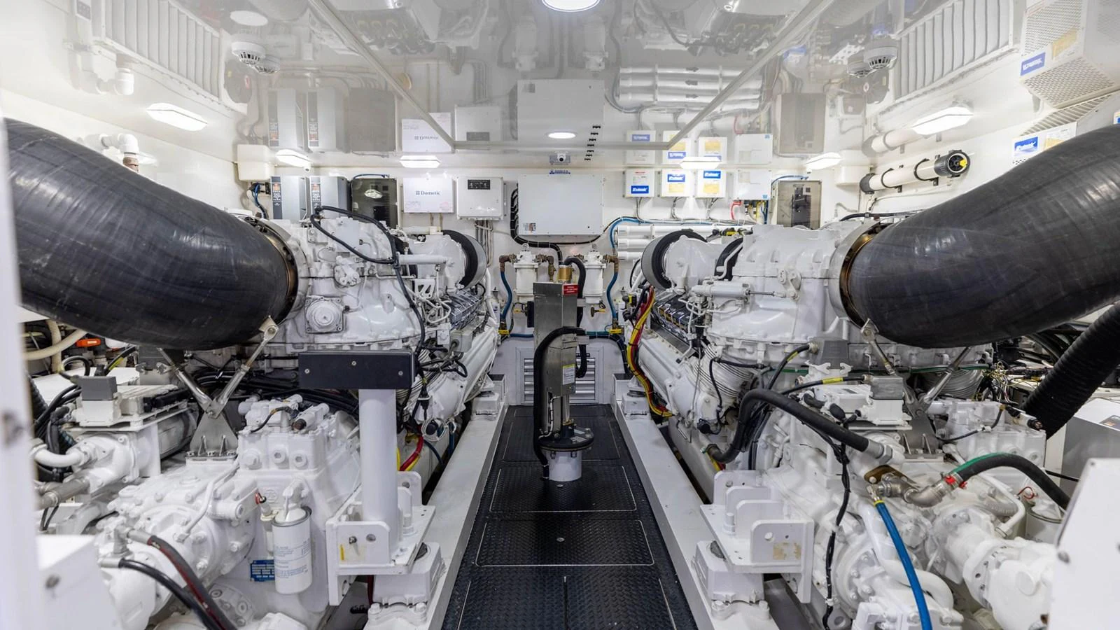 The engine room showcases powerful machinery and a clean, organized layout. aboard CE Yacht for Sale