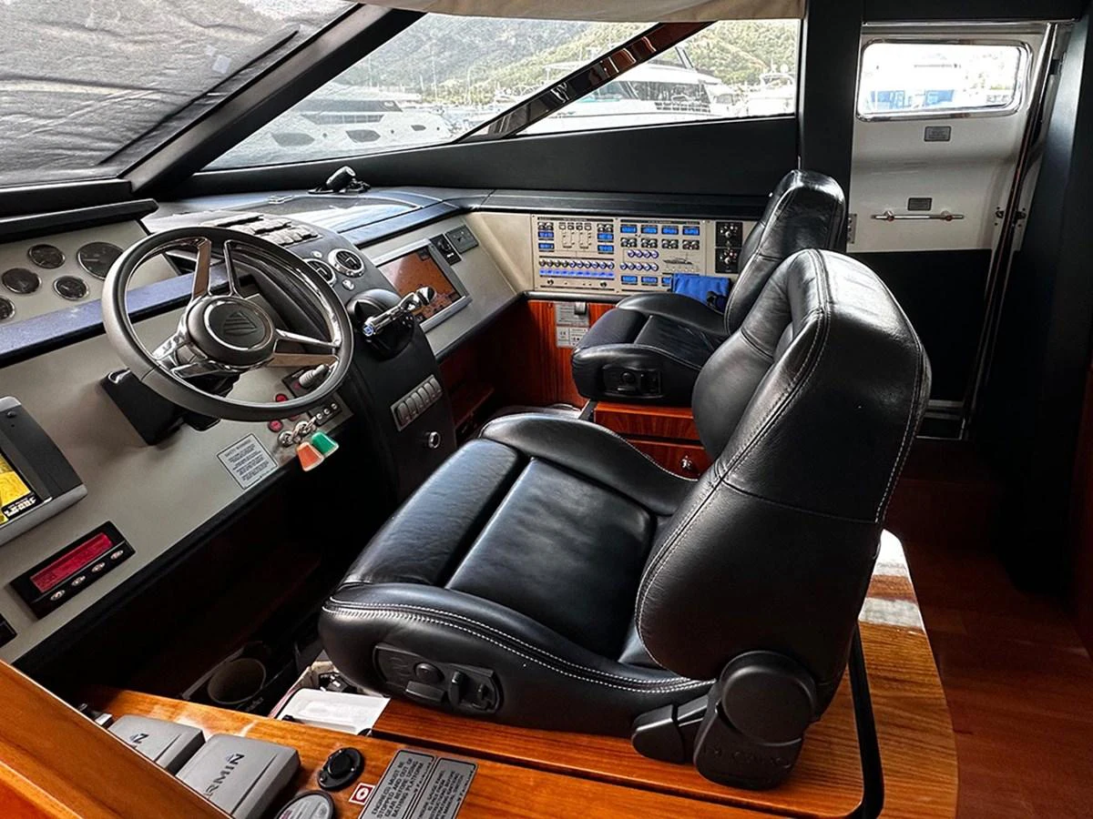 The helm station features luxurious leather seating and state-of-the-art navigation equipment. aboard SEDEF Yacht for Sale