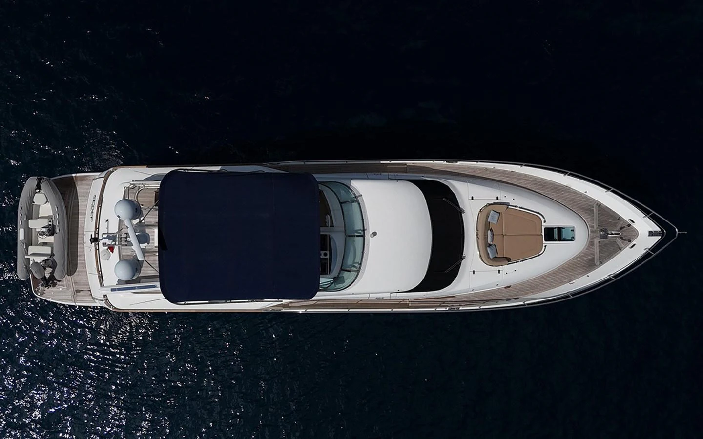 A sleek yacht viewed from above, showcasing its elegant design and spacious deck areas. aboard SEDEF Yacht for Sale