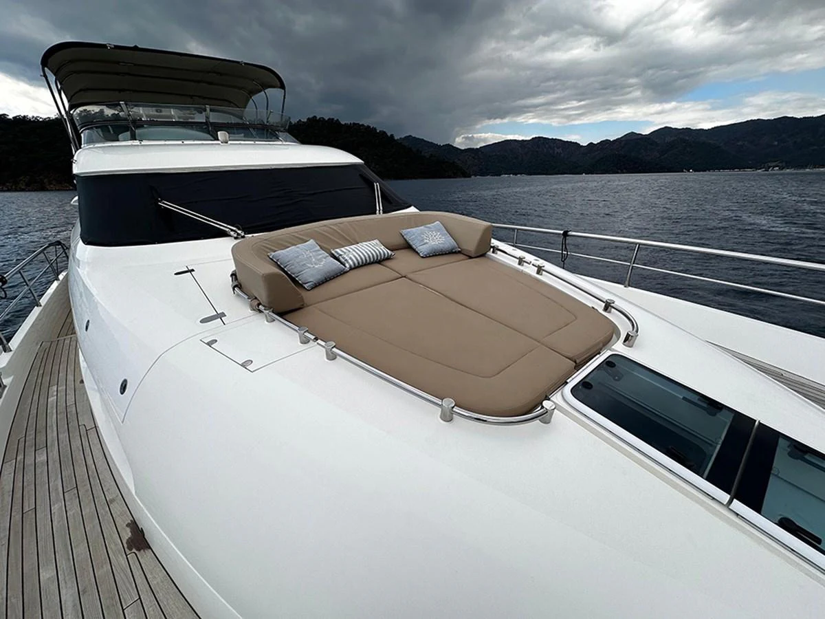 The yacht's foredeck features a spacious sunpad with plush cushions, perfect for relaxation. aboard SEDEF Yacht for Sale