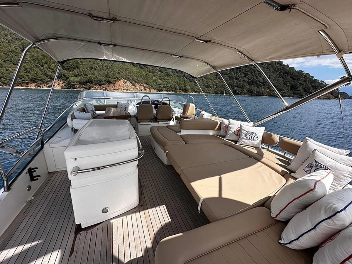 The flybridge offers a spacious and comfortable lounging area with stunning views of the surrounding waters. aboard SEDEF Yacht for Sale