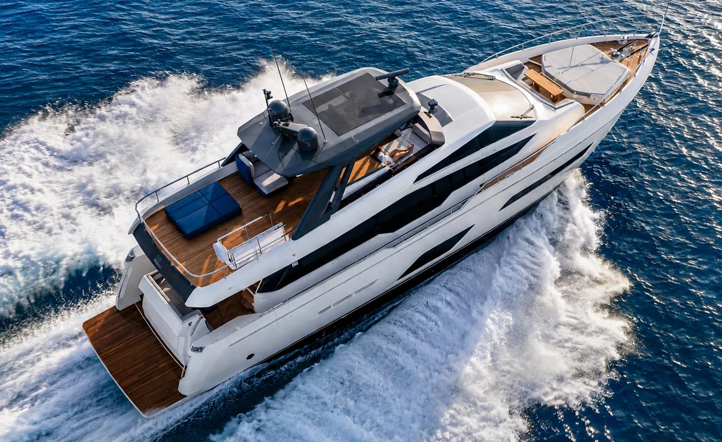A sleek and modern yacht cruises swiftly through the open water, showcasing its elegant design and spacious decks. aboard LD Yacht for Sale