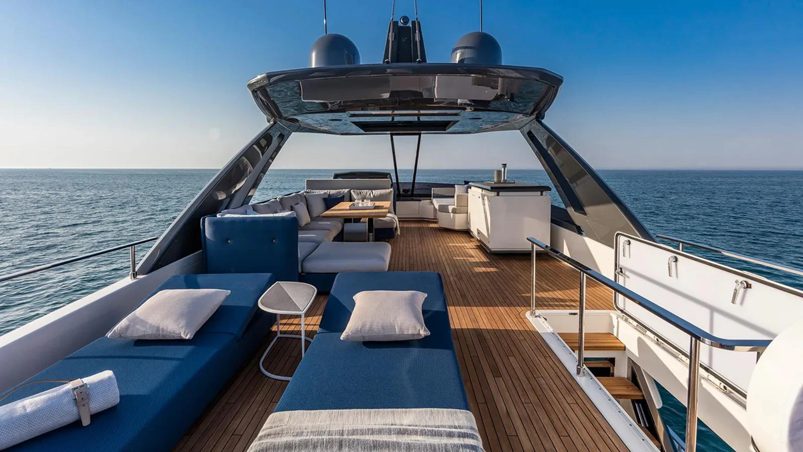 The flybridge offers a spacious and luxurious outdoor lounging area with stunning ocean views. aboard LD Yacht for Sale