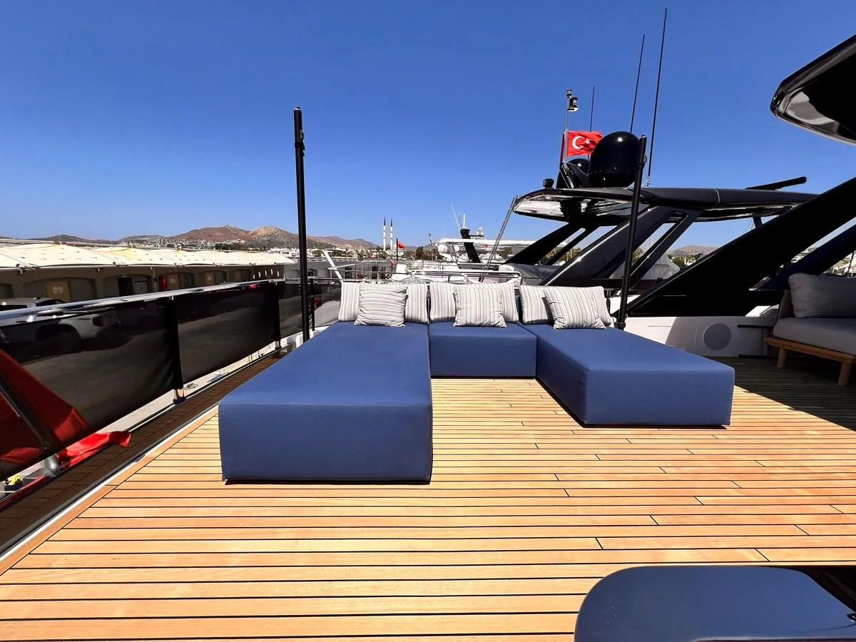 The sundeck features comfortable blue loungers perfect for relaxation under the sun. aboard LD Yacht for Sale