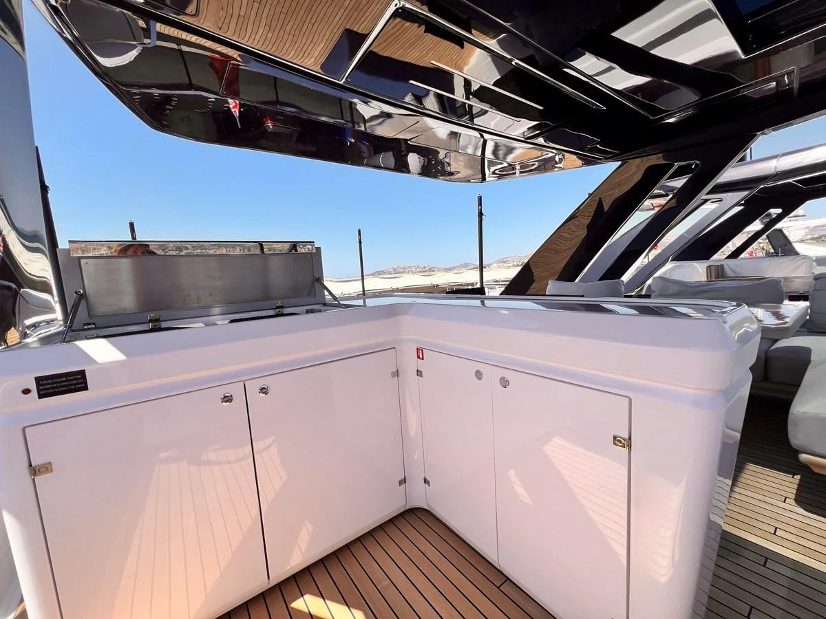 The yacht features a sleek outdoor galley with modern appliances and ample storage, perfect for alfresco dining. aboard LD Yacht for Sale