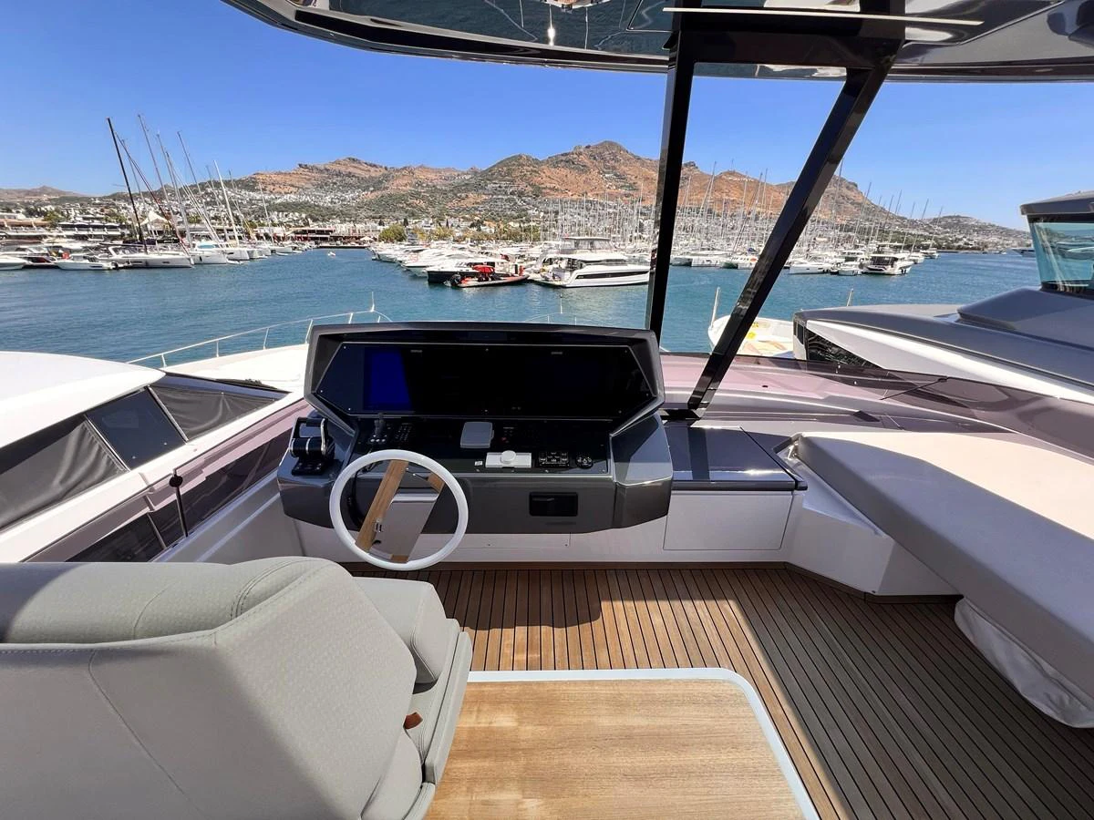 The helm station offers a commanding view of the marina and surrounding landscape. aboard LD Yacht for Sale