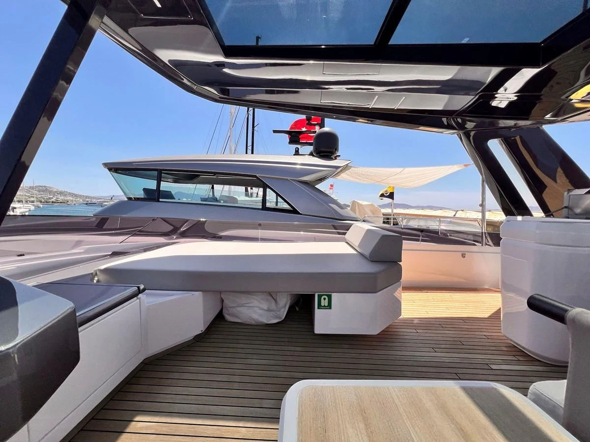 The flybridge offers a sleek, modern design with ample seating and a panoramic view. aboard LD Yacht for Sale