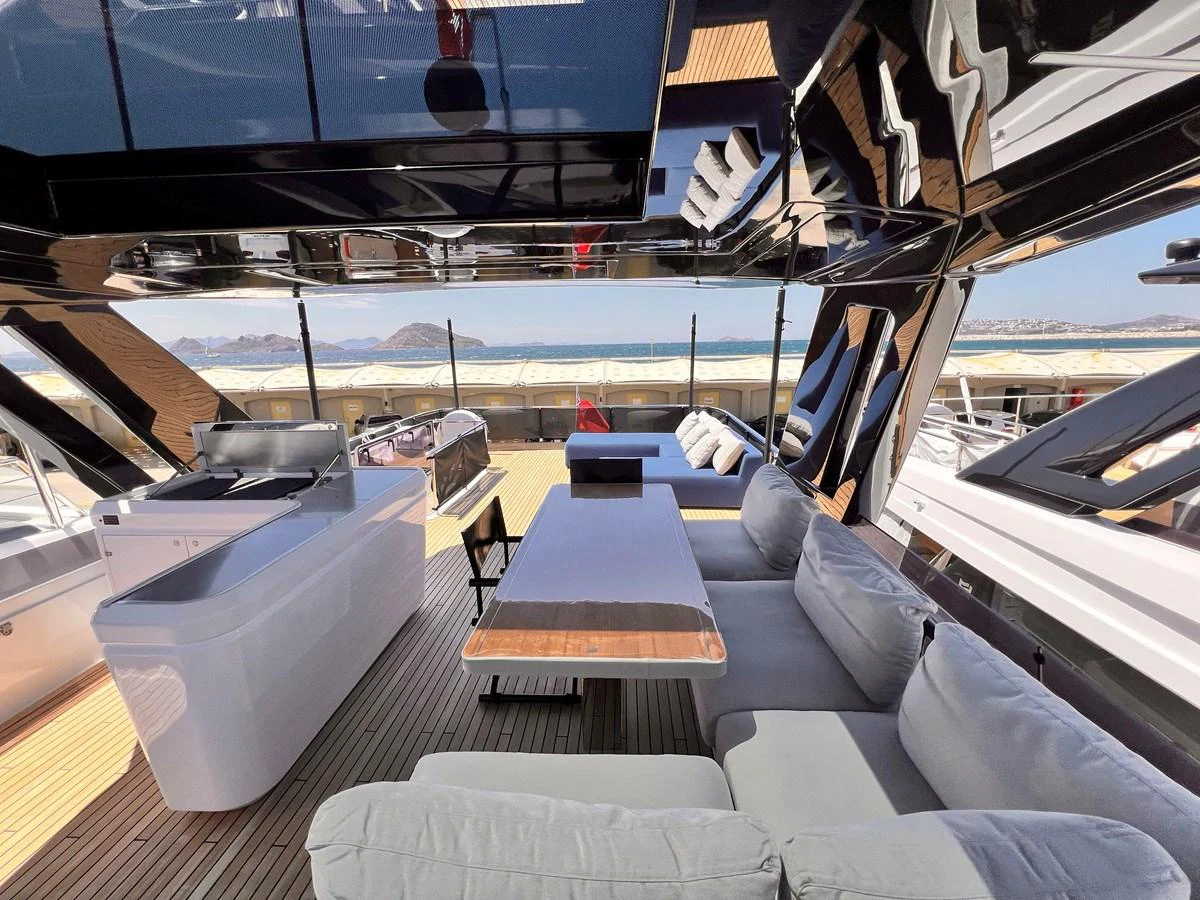 The sundeck offers a luxurious space with comfortable seating and a stunning view. aboard LD Yacht for Sale