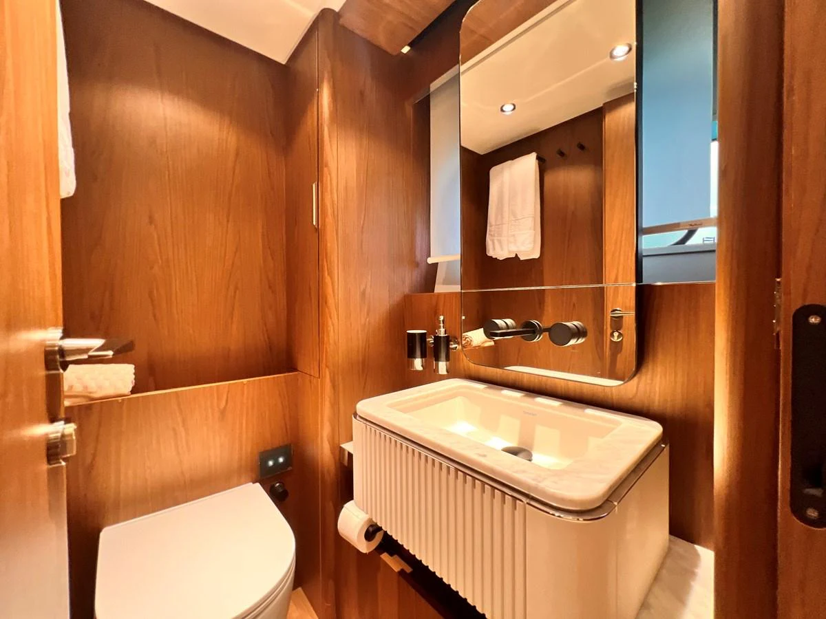 A well-appointed yacht bathroom featuring a sleek sink and modern fixtures. aboard LD Yacht for Sale
