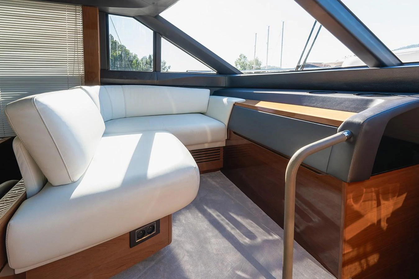 A comfortable seating area with modern design and ample natural light. aboard DAPHNE Yacht for Sale