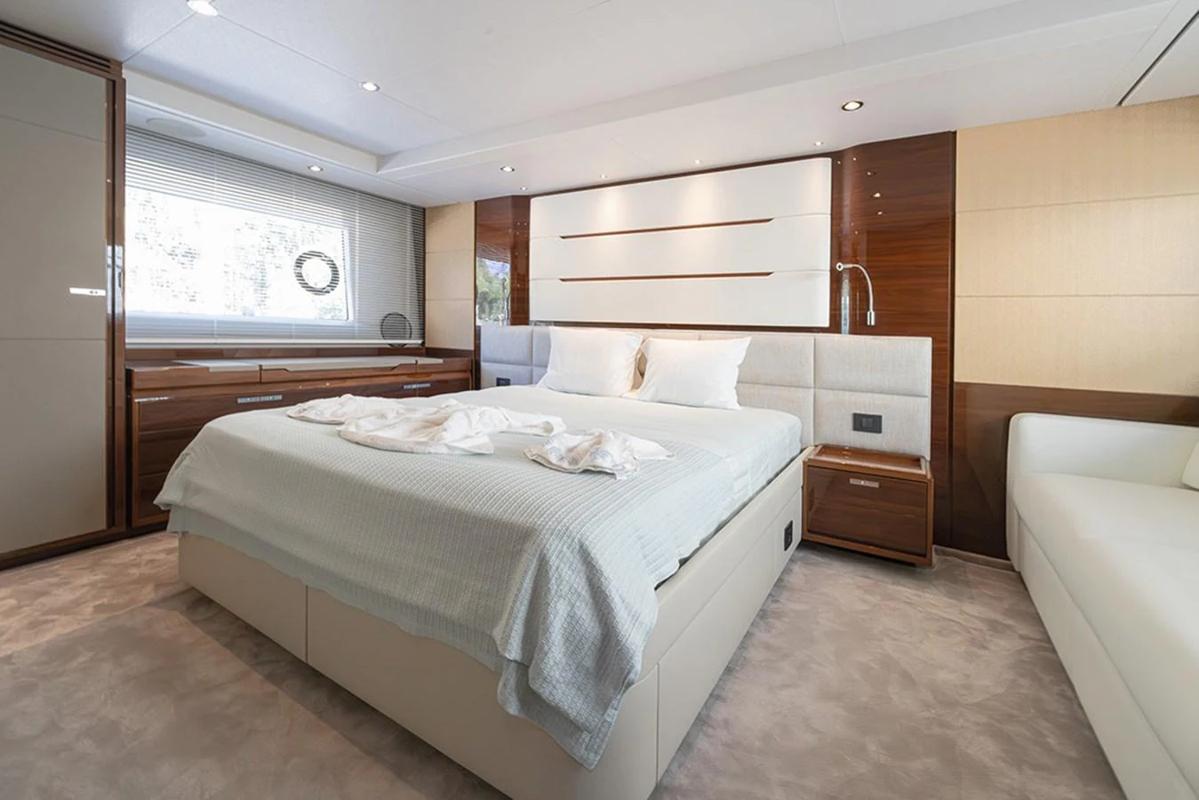 The master stateroom features a luxurious bed with elegant furnishings and ample natural light. aboard DAPHNE Yacht for Sale