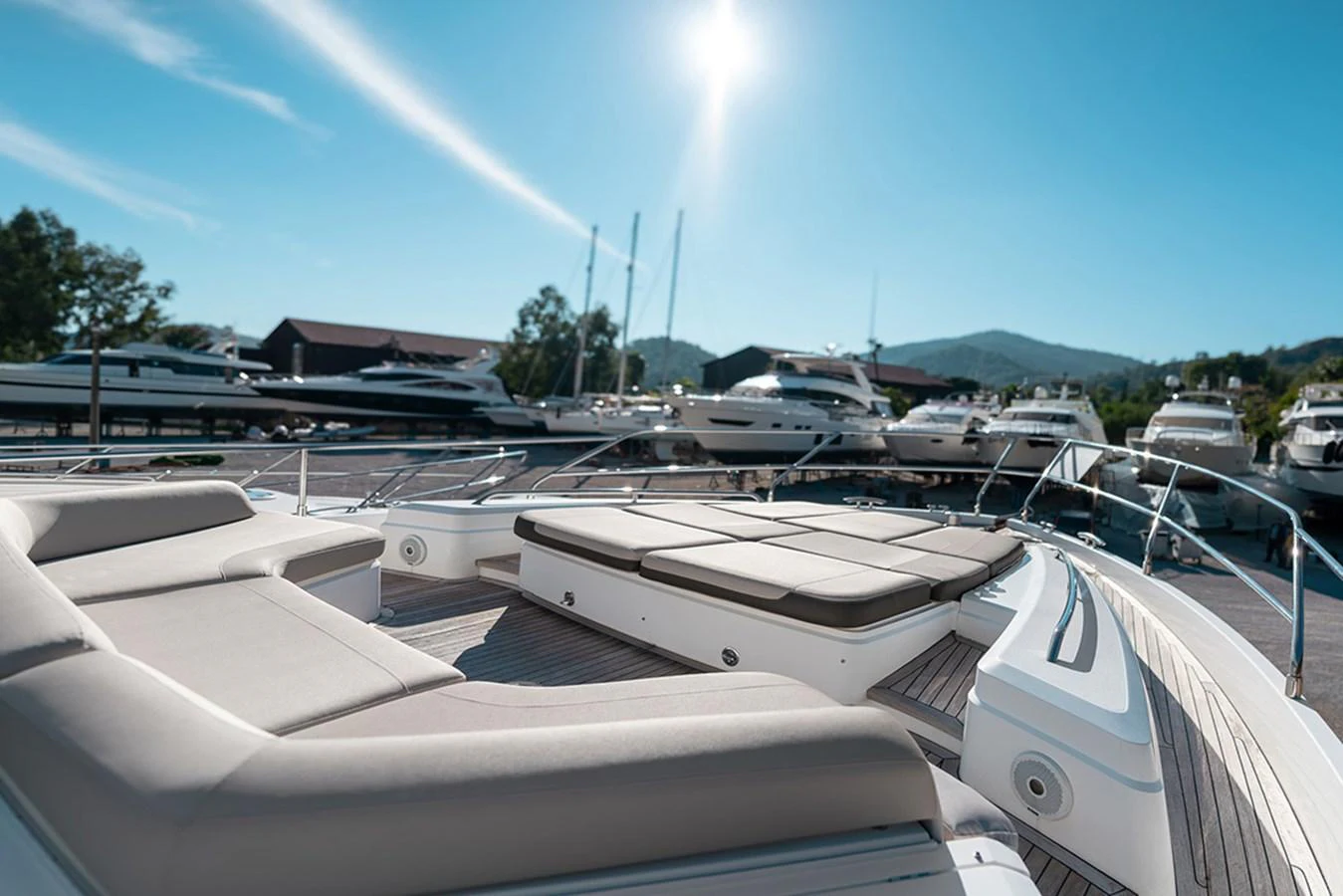 The foredeck offers luxurious sunpads and seating with a stunning marina backdrop. aboard DAPHNE Yacht for Sale