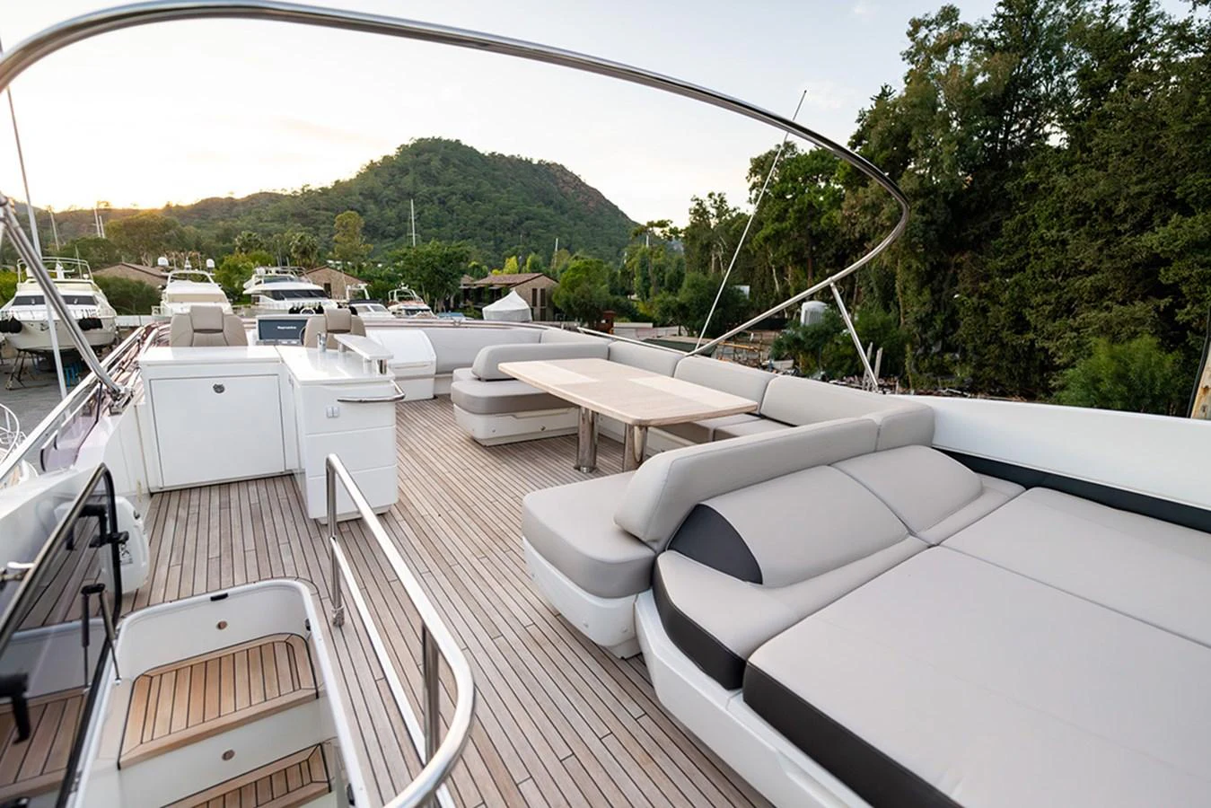 The flybridge offers spacious seating and lounging areas with a scenic view. aboard DAPHNE Yacht for Sale
