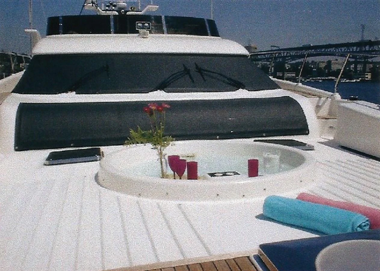 The sundeck features a luxurious jacuzzi with a view of the surrounding waters. aboard SHOW ME THE MONEY Yacht for Sale