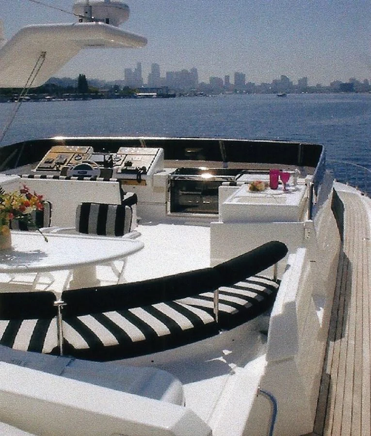 The flybridge offers a spacious and luxurious outdoor area with stunning views of the city skyline. aboard SHOW ME THE MONEY Yacht for Sale