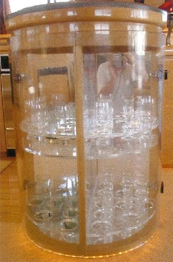 A stylish glass cabinet showcasing an array of glassware. aboard SHOW ME THE MONEY Yacht for Sale