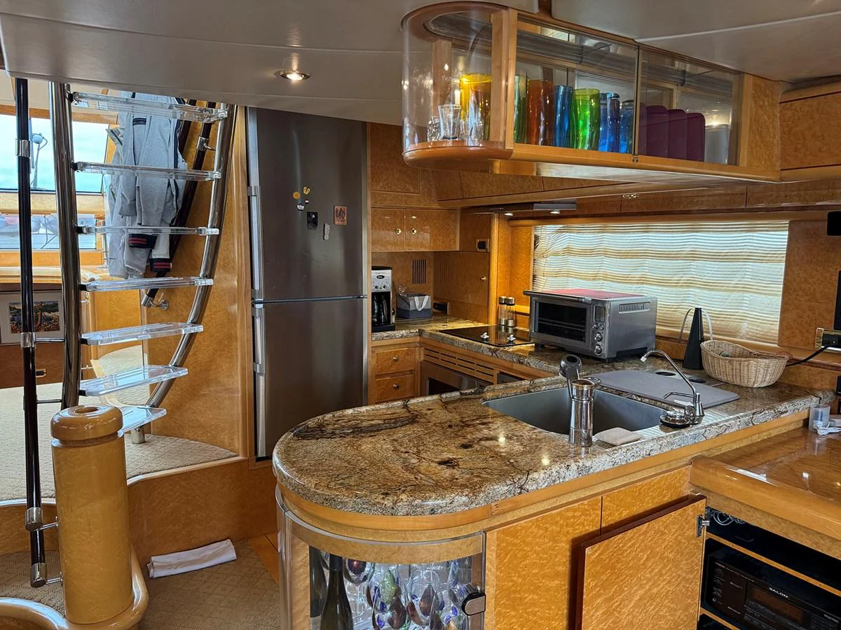 The yacht's galley features modern appliances and a stylish design, perfect for onboard culinary experiences. aboard SHOW ME THE MONEY Yacht for Sale