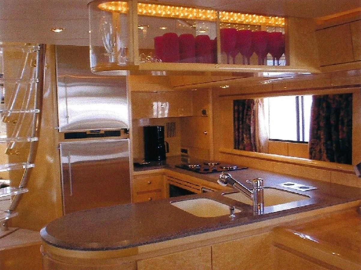 The yacht's galley features modern appliances and ample counter space for gourmet meal preparation. aboard SHOW ME THE MONEY Yacht for Sale
