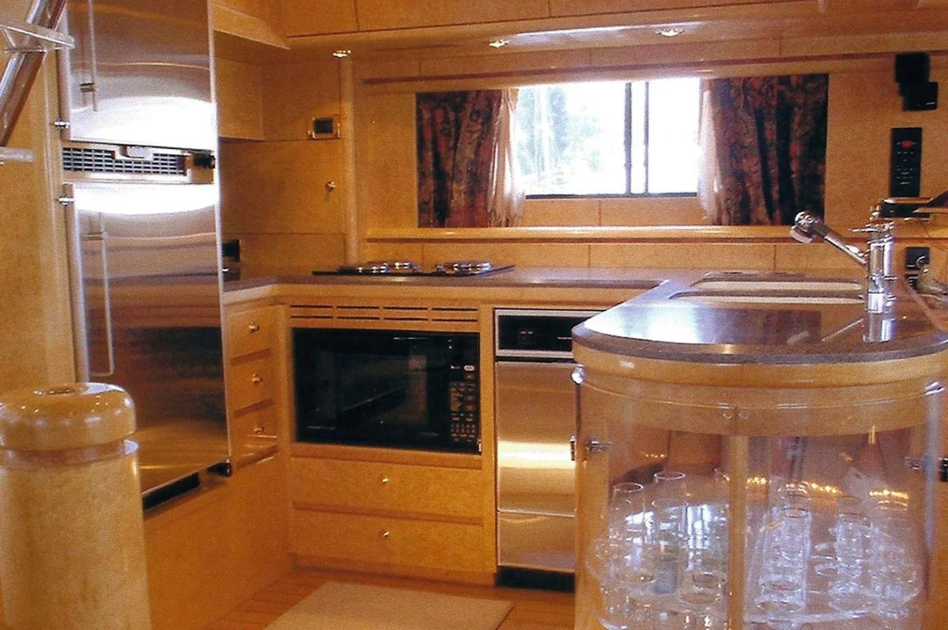 The yacht's galley is equipped with modern appliances and ample storage, creating a functional and stylish cooking space. aboard SHOW ME THE MONEY Yacht for Sale