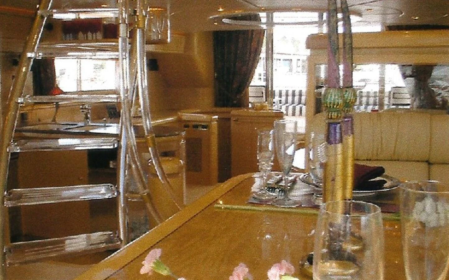 The yacht's interior features a luxurious dining area with elegant table settings and comfortable seating. aboard SHOW ME THE MONEY Yacht for Sale