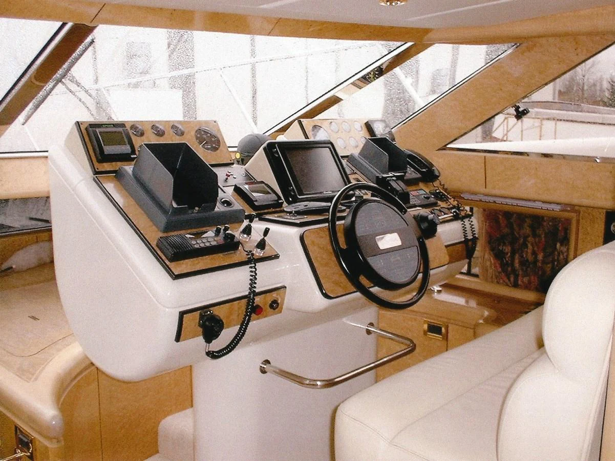 The helm station features advanced navigation equipment and luxurious seating. aboard SHOW ME THE MONEY Yacht for Sale