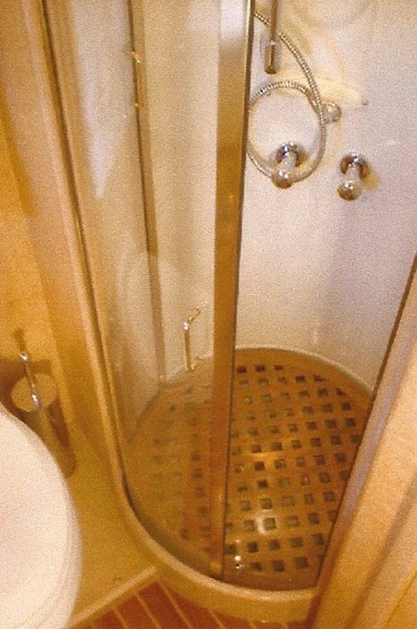 A compact and well-appointed yacht bathroom with a modern shower enclosure. aboard SHOW ME THE MONEY Yacht for Sale