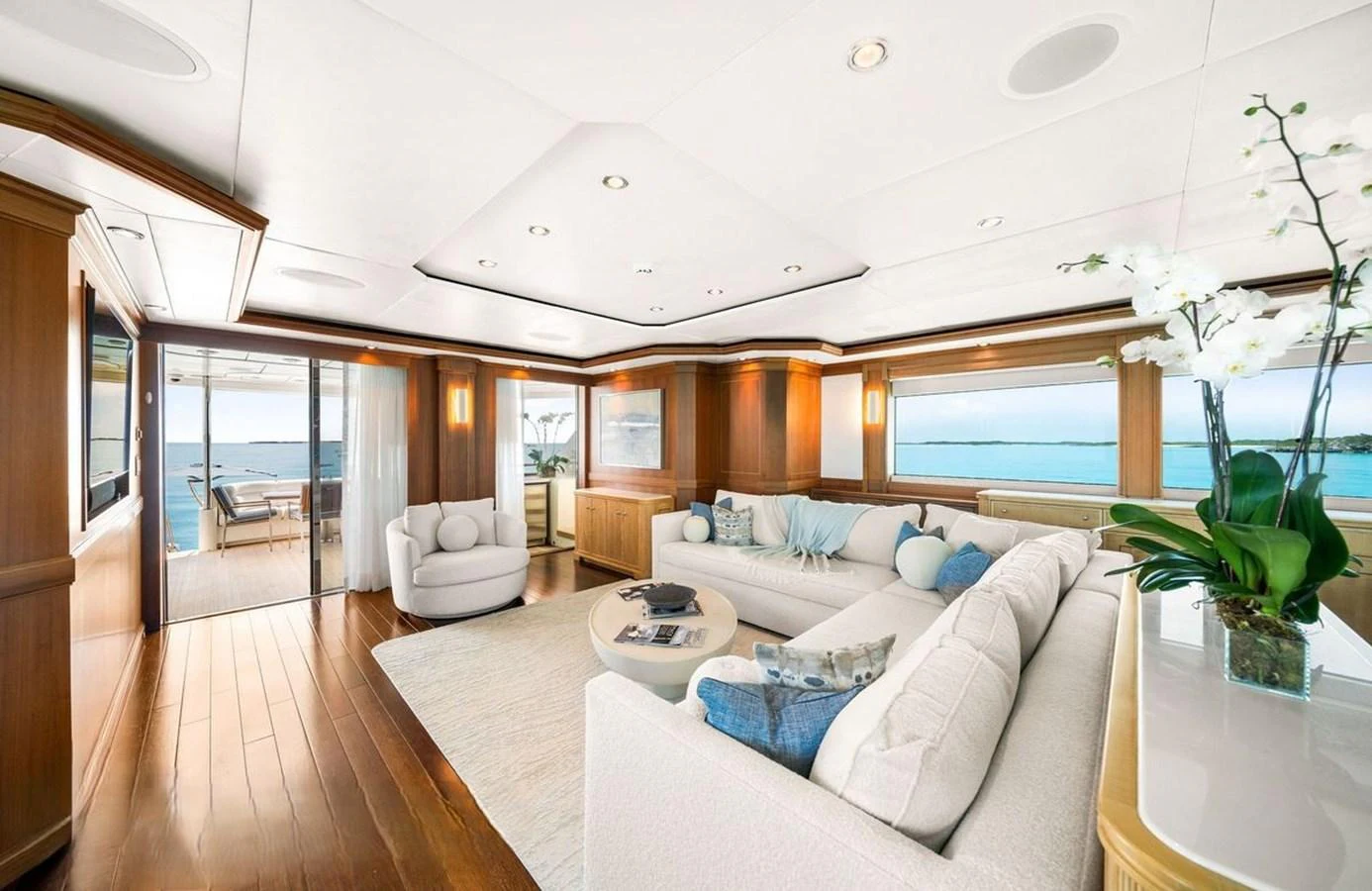 The salon offers a spacious and elegant area with ample seating and panoramic ocean views. aboard BLACK SHEEP Yacht for Sale