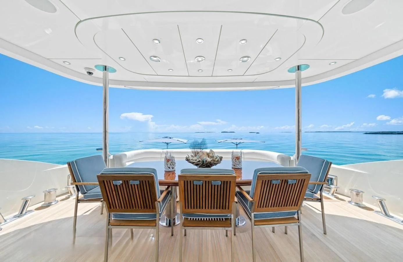 The aft deck offers a serene seating area with stunning ocean views. aboard BLACK SHEEP Yacht for Sale
