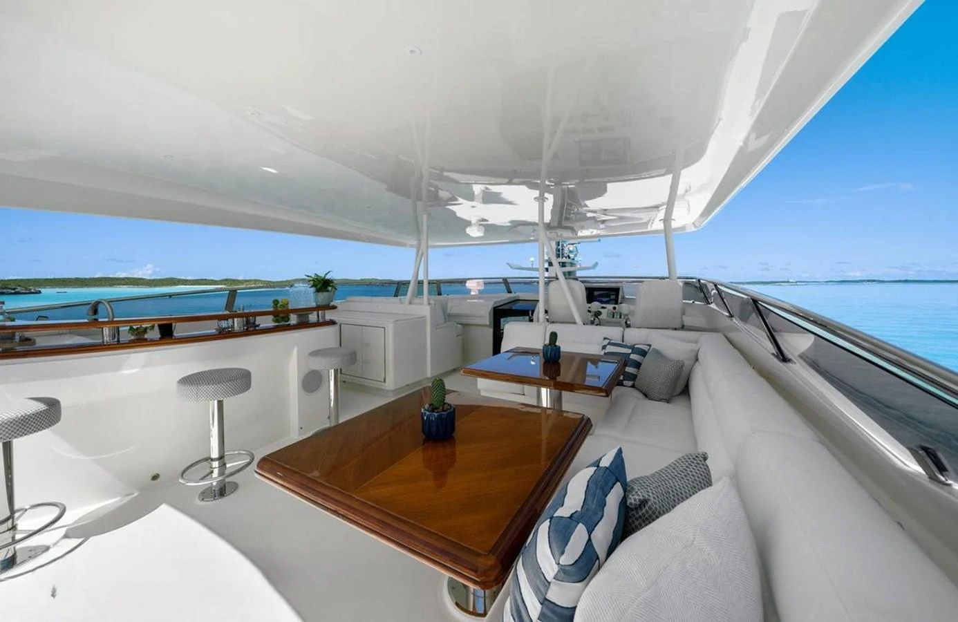 The flybridge offers a spacious and luxurious seating area with stunning ocean views. aboard BLACK SHEEP Yacht for Sale
