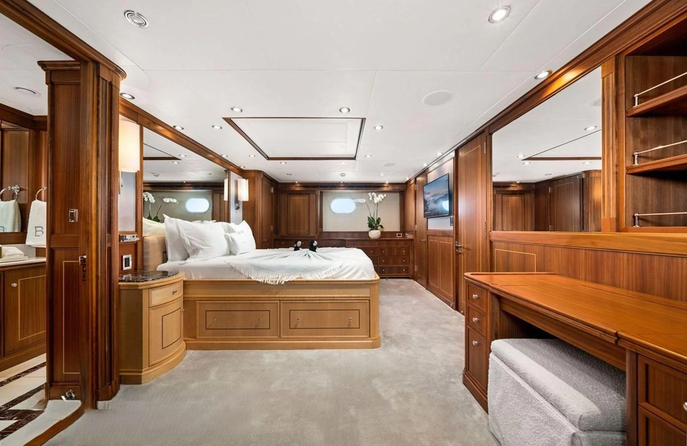 The master stateroom features luxurious wood paneling and elegant furnishings, creating a warm and inviting atmosphere. aboard BLACK SHEEP Yacht for Sale