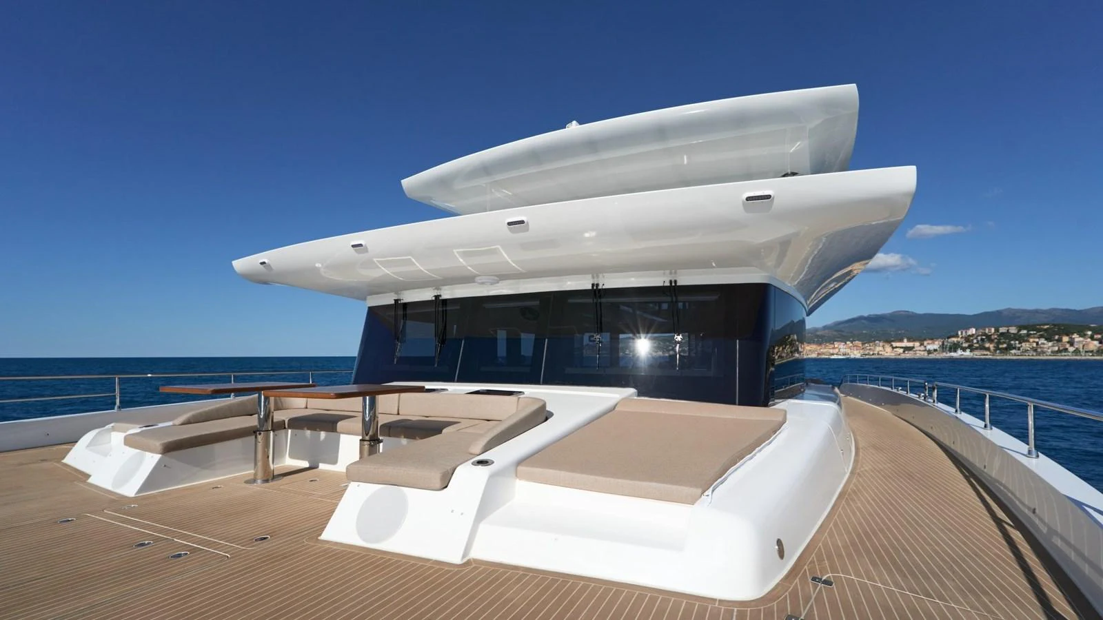The yacht's foredeck features spacious sun pads and a seating area, perfect for relaxation. aboard ATRAVERSIA Yacht for Sale