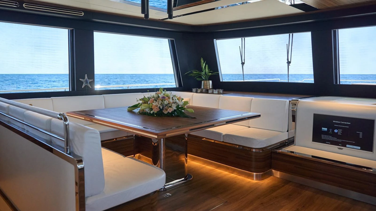 The salon offers a luxurious and comfortable seating area with panoramic ocean views. aboard ATRAVERSIA Yacht for Sale
