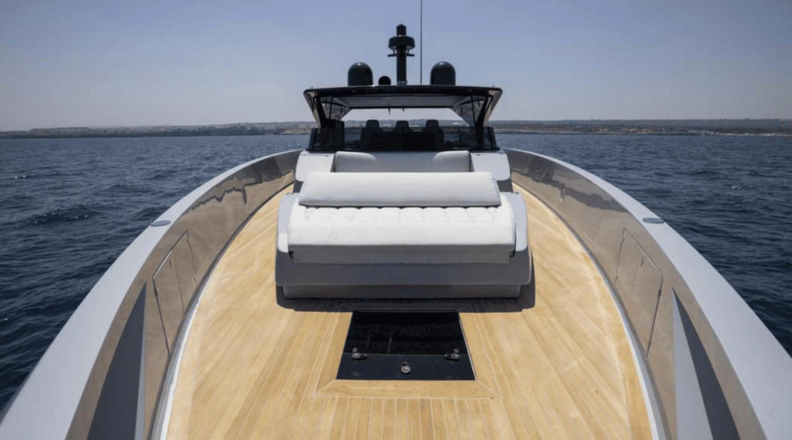 The yacht's foredeck features a spacious sunbathing area with a plush sunpad and sleek design. aboard MANDAYACHT S07 SPIDER Yacht for Sale