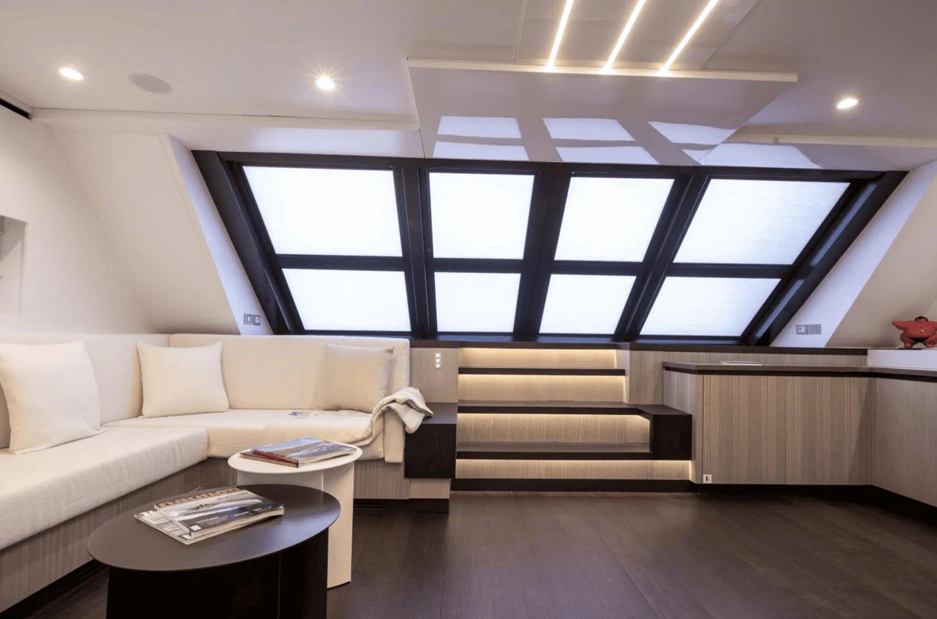 The yacht's interior features a modern lounge area with large windows and sleek design elements. aboard MANDAYACHT S07 SPIDER Yacht for Sale