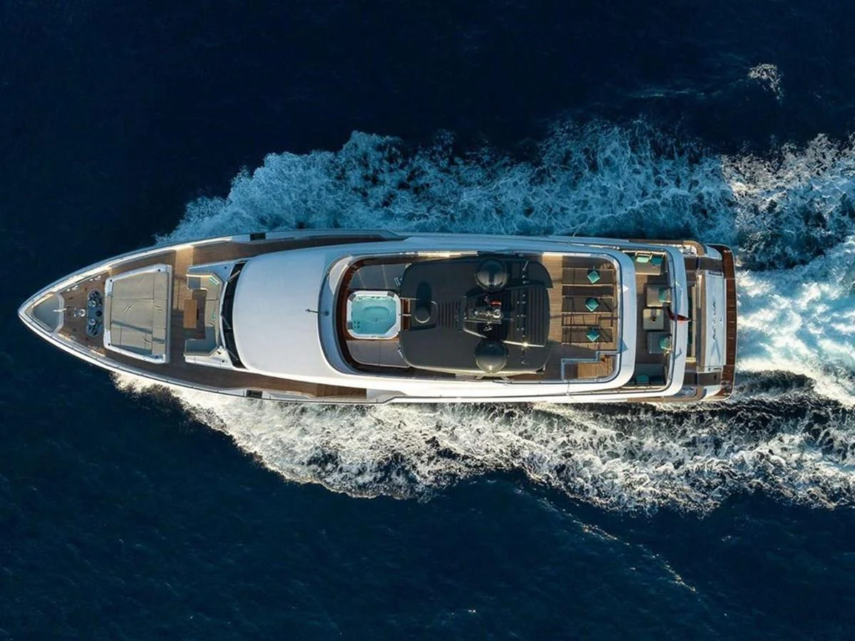 Aerial view of a luxurious yacht cruising through the deep blue sea. aboard ON Yacht for Sale