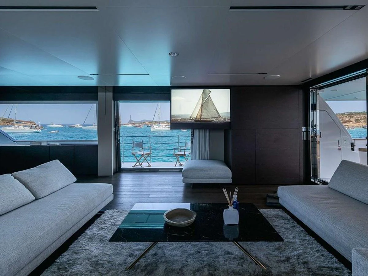 The salon offers a luxurious and comfortable space with panoramic views of the sea. aboard ON Yacht for Sale