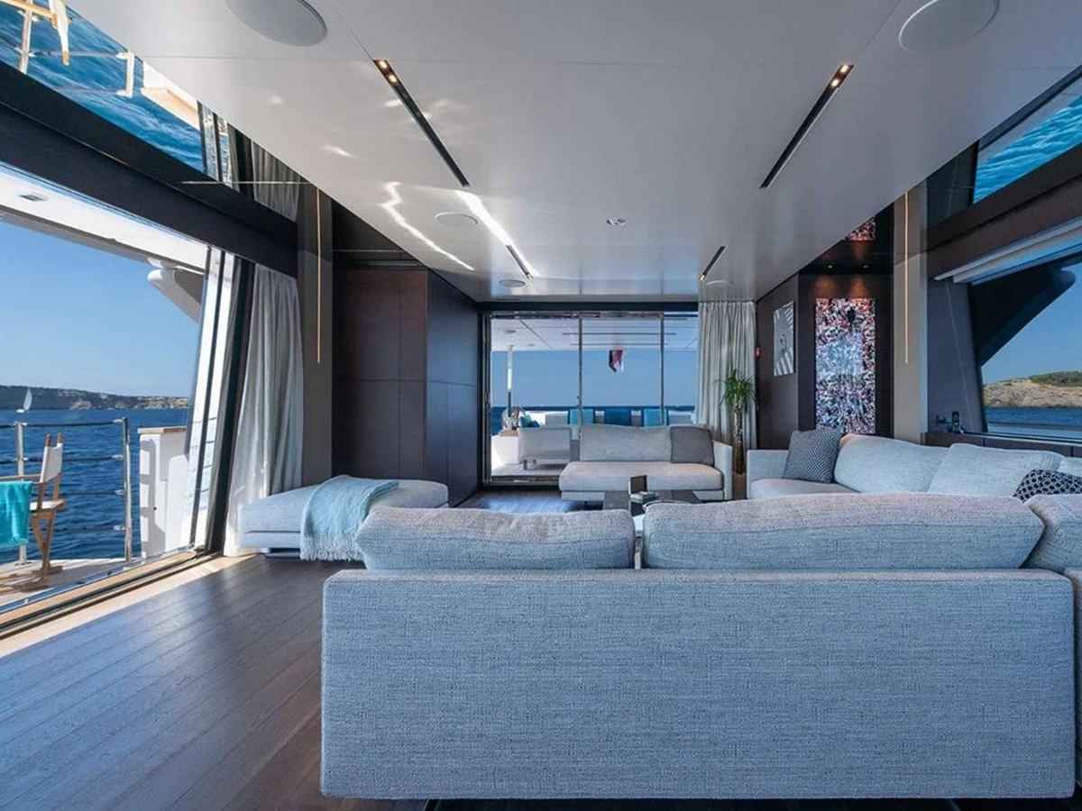 The spacious salon offers panoramic views and luxurious comfort with modern furnishings. aboard ON Yacht for Sale